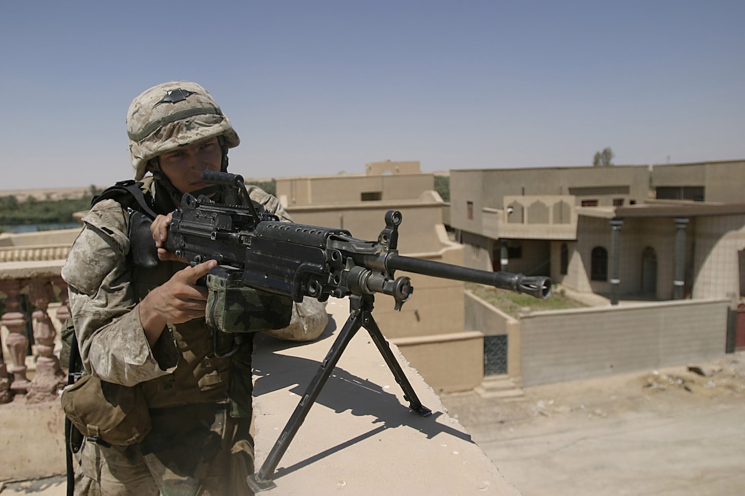 Hit, Al Anbar, Iraq (July 22, 2005)--State College, Penn., native Cpl. Andrei V. Chernyshev, a sawgunner with Company "K", 3rd Battalion, 25th Marine Regiment provides security. (Official USMC Photo by Corporal Ken Melton)