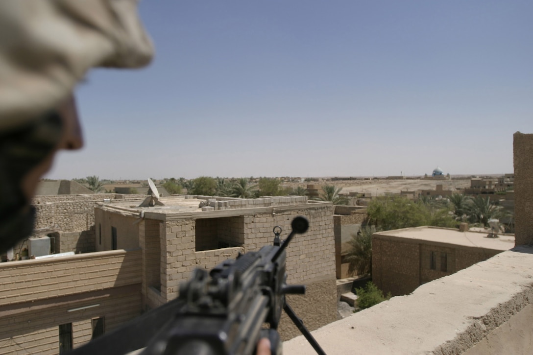 Hit, Al Anbar, Iraq (July 22, 2005)--Cpl. Andrei V. Chernyshev, 24, of State College, Penn., and sawgunner with Company "K", 3rd Battalion, 25th Marine Regiment provides security. (Official USMC Photo by Corporal Ken Melton)