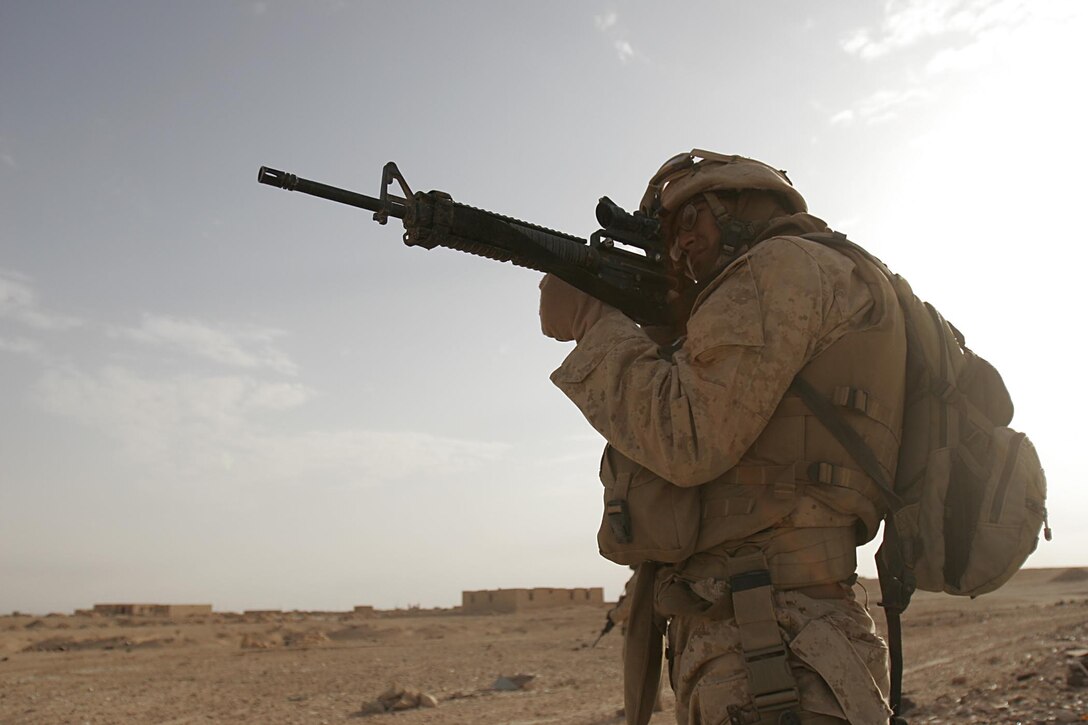 Husaybah, Iraq ( November 5, 2005)--Lance Cpl. Marcello T. Bueno, a 21-year-old combat engineer from Kaufman, Texas sights in during a patrol with 2nd platoon, 1st LAR during Operation Steel Curtain. (Official U. S. Marine Corps photo by Corporal Ken Melton)