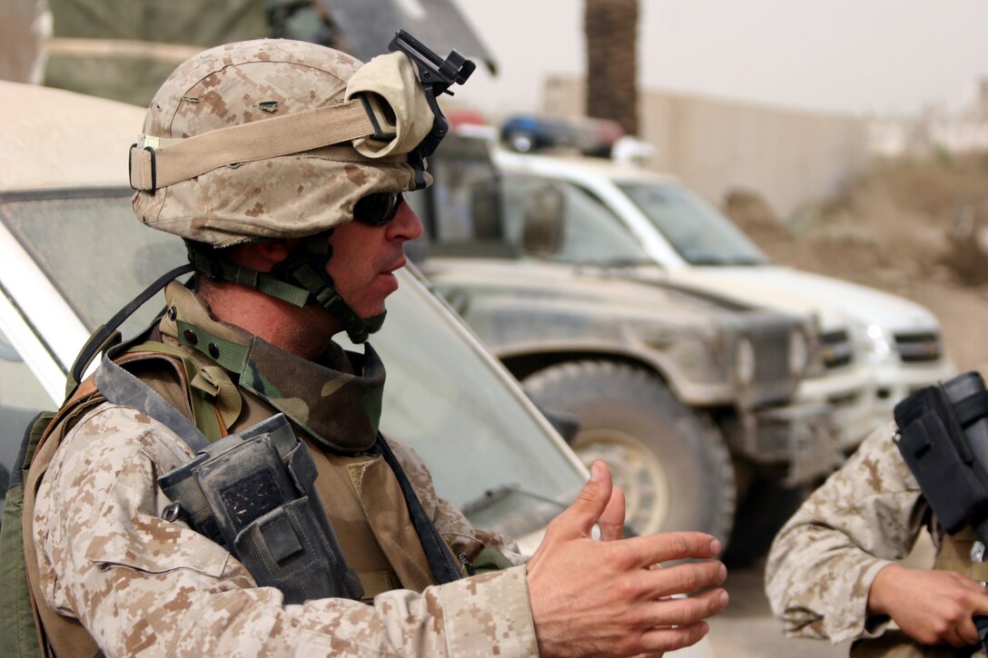 AR RAMADI, Iraq (November 5, 2005) - Major Dan Wagner, team chief for Team 4, 6th Civil Affairs Group, speaks with his Marines before embarking on a patrol through the streets of Ar Ramadi Nov. 5. Photo by Cpl. Shane Suzuki