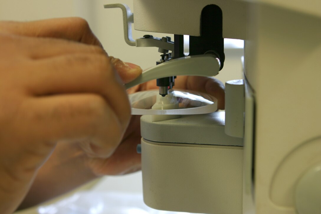 Hospitalman Michael W. Mose, an optician with 2nd Marine Division, is in charge of sculpting and shaping every lens used in eyeglasses here.  The 25 year-old from Mamou, La. has made more than 180,000 lenses during his career with the Navy. (Official U.S. Marine Corps photo by Cpl. Shawn C. Rhodes)