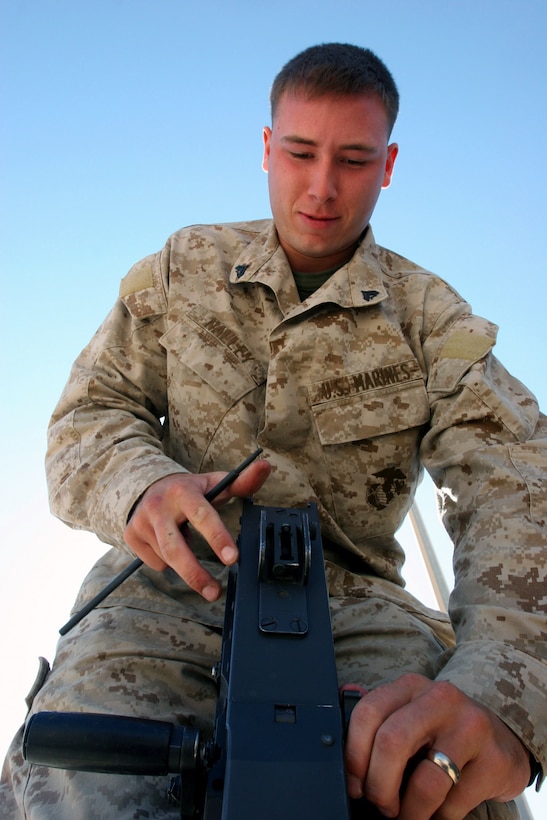 AL ASAD, Iraq ? Corporal Joshua Nalley, an Immediate Reaction Team machine gunner takes a part his machine gun during a routine inspection of his gear. Nalley, recently the recipient of a combat meritorious promotion, is an Easley, S.C., and joined the Marine Corps shortly after graduating high school in 2003.