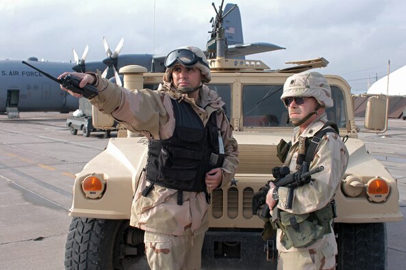 KARSHI-KHANABAD AIR BASE, Uzbekistan -- Staff Sgt. Robert Polanco shows Lt. Col. Donald Klinko areas where the security forces are guarding the flightline.  Sergeant Polanco is assigned to 416th Expeditionary Mission Support Squadron's security forces flight.  Colonel Klinko is the squadron's commander.  (U.S. Air Force photo by Senior Airman Matt Rosine)