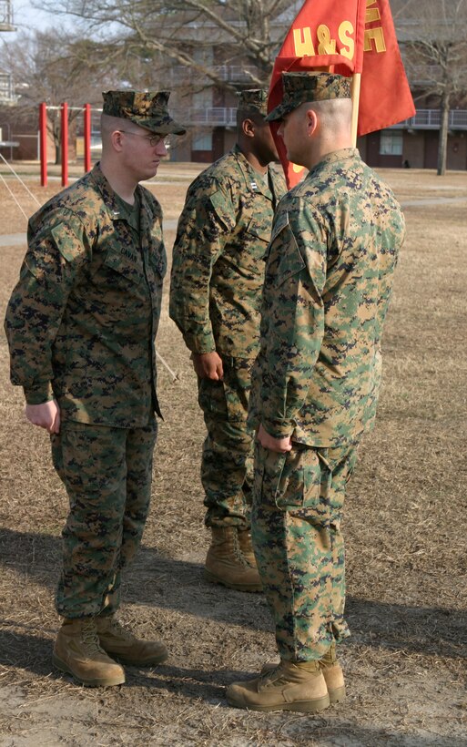 MARINE CORPS BASE CAMP LEJEUNE, N.C. -- 1st Lt. Joshua E. Cavan, Headquarters and Service company, 1st Battalion, 6th Marine Regiment commanding officer, back left, faces his enlisted advisor shortly during a change of command ceremony Jan. 7 here.  Cavan was relieved of his company command duties by Capt. Waheed Khan, and now serves as executive officer for H&S, overseeing the training of more than 350 Marines.
