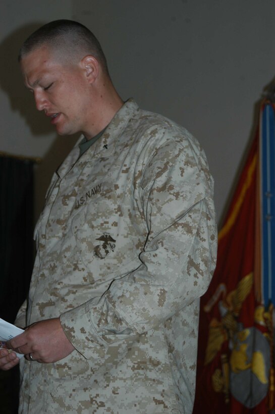 CAMP HURRICANE POINT Ar Ramamdi, Iraq (April 7, 2005) - Navy Lt. Aaron T. Miller, chaplain, 1st Battalion, 5th Marine Regiment, says a word of prayer during the memorial ceremony held here for Cpl. Garry W. Rimes, a 30-year-old rifleman and scout with 2nd Platoon, Company W, 1st Battalion, 5th Marine Regiment, who was killed by enemy sniper fire while fighting the Global War on Terrorism. Rimes, from Rizal, Philippines, is survived by his wife, Happy. Photo by Cpl. Tom Sloan