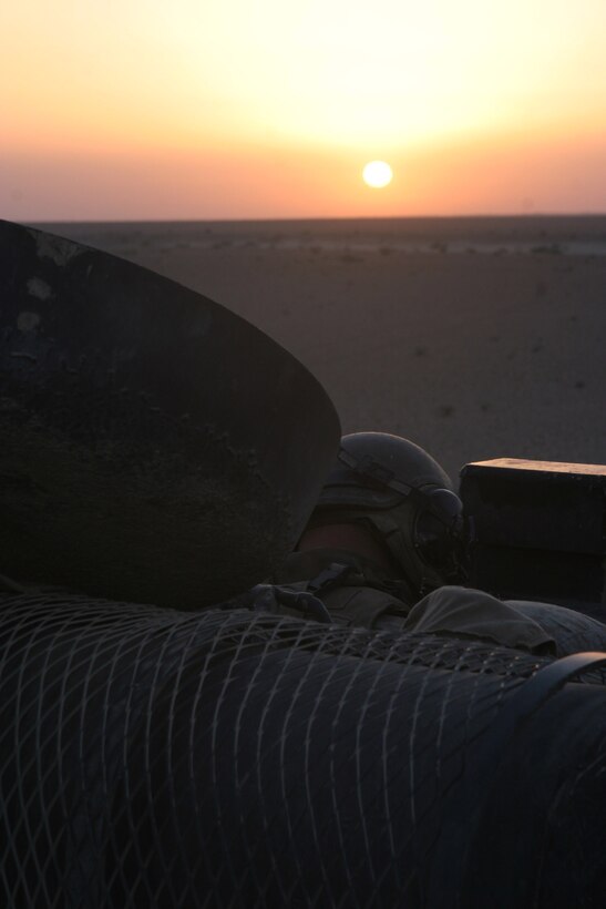 LAKE THARTHAR REGION, Iraq - An Assault Amphibian Vehicle commander takes a nap in the early morning hours, June 19, before the day's operations.  Marines with Task Force Hard, primarily those with 1st Battalion, 6th Marine Regiment, searched for insurgent weapons caches  as part of Operation Khandjar (Iraqi for dagger), June 17 through 22.  U.S. Marine Corps photo by Sgt. Stephen D'Alessio (RELEASED)