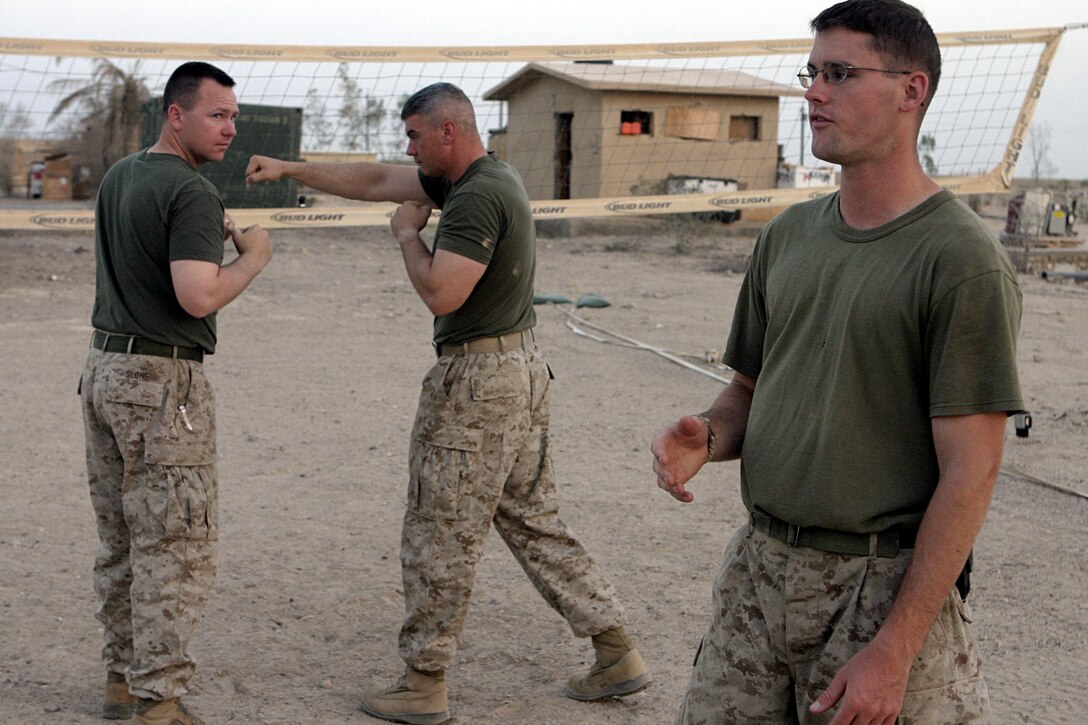 CAMP BAHARIA, Iraq - First Lieutenant Dana Sanford, 1st Battalion, 6th Marine Regiment's motor transport section's assistant officer-in-charge, oversees a martial arts training session here July 29.  The 24-year-old Sterling, Mass. native is a green belt instructor in the Marine Corps Martial Arts Program, and is currently teaching several Marines and sailors in his unit self-defense.