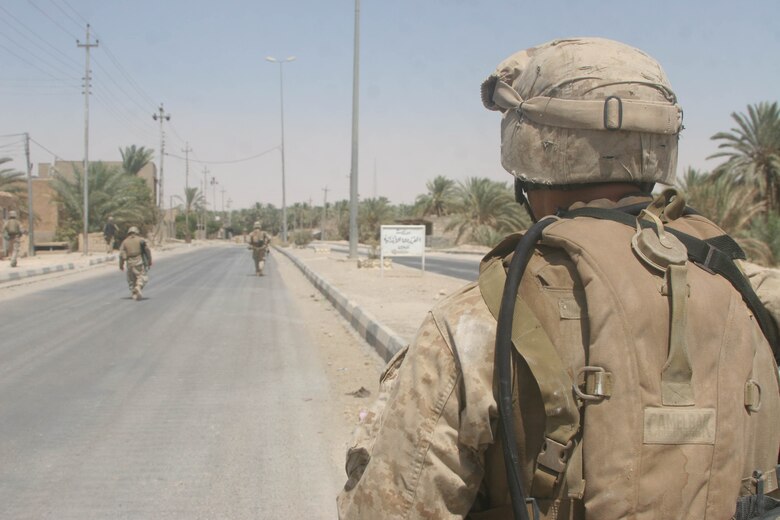 BANI DAHRI, Iraq (July 13, 2005)- Lance Cpl. Raphael P. Ramos, 21, from Carolina, Puerto Rico and a squad automatic weapon gunner with 1st Squad, 3rd Platoon, Company K, 3rd Battalion, 2nd Marine Regiment, Regimental Combat Team-2 patrols through the city during Operation Quick Strike. The 2003 Ana Roque High School graduate is making his first deployment in support of Operation Iraqi Freedom and has decided to continue his career and become a Marine Corps officer. (Official USMC photo by Lance Cpl. Lucian Friel )(RELEASED)