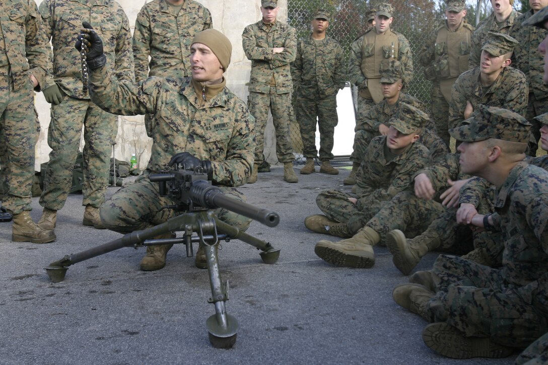 MARINE CORPS BASE CAMP LEJEUNE, N.C. -- Sergeant John Paterson, a Marine with 3rd Battalion, 8th Marine Regiment, prepares to show his students how to properly load ammunition into a .50 caliber machinegun during a security and stability operations training exercise here Dec. 7.  Third Battalion, Eighth Marine Regiment is currently preparing for its second tour of duty in Iraq after having returned from Fallujah nearly four months ago.