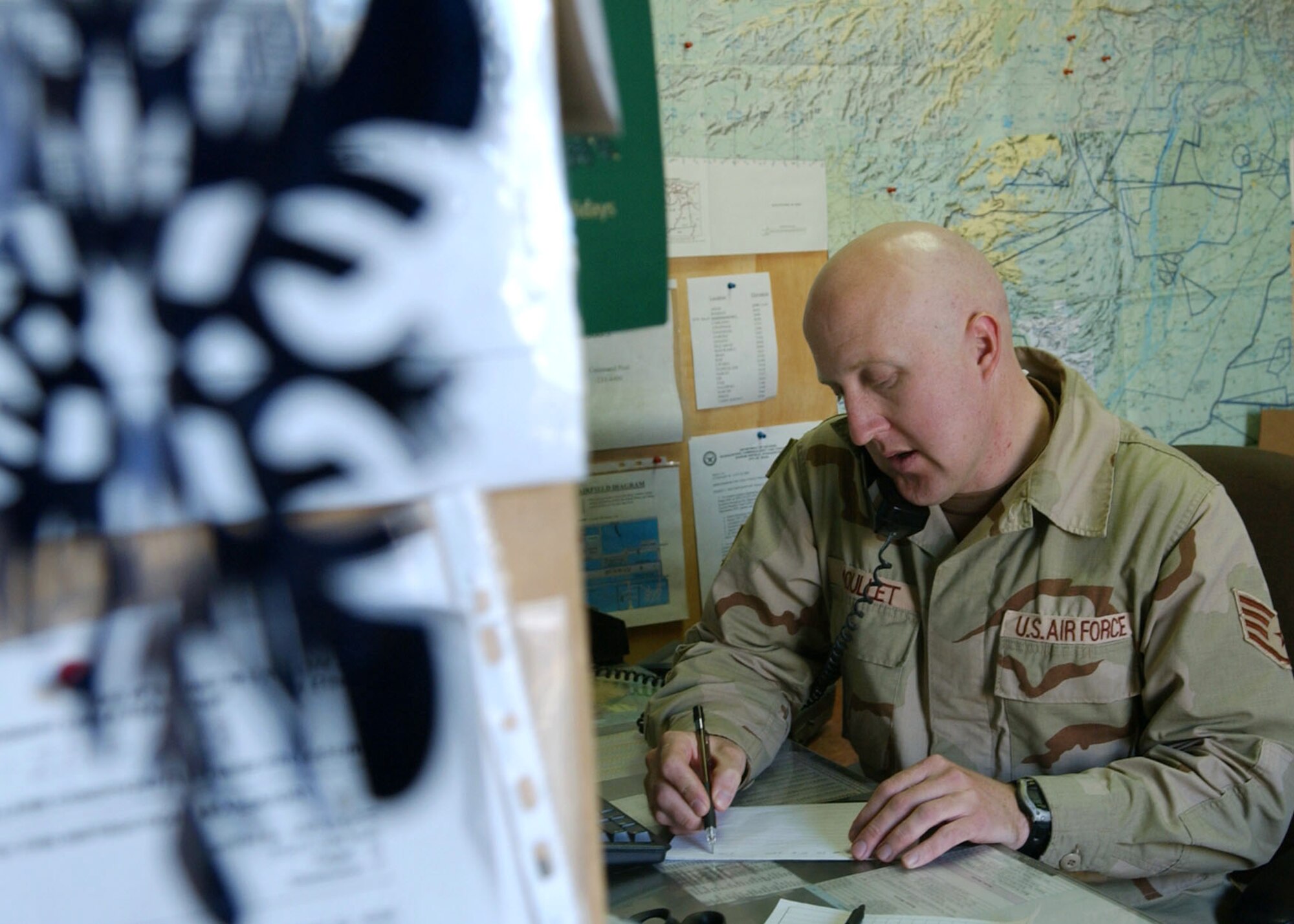 BAGRAM AIR BASE, Afghanistan -- Staff Sgt. Jim Moullet provides a weather update used for flight planning.  Besides hourly forecasts, the 455th Air Expeditionary Wing's combat weather team reports local weather data to the Air Force Weather Agency.  Sergeant Moullet is deployed from Ft. Polk, La.  (U.S. photo by Staff Sgt. Jennifer Lindsey)
