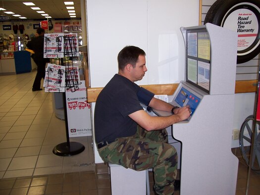 MANAS AIR BASE, Kyrgyzstan -- Vince Alford, a tower controller here, talks to a KC-135 Stratotanker pilot about a change in flight plans here.  Mr. Alford is an Air Force Contingency Augmentation Program liaison contract controller who monitors 40 to 70 civilian and military aircraft movements a day on the dual-use runway the base shares with Manas International Airport.  (U.S. Air Force photo by Capt. Alisen Iversen)