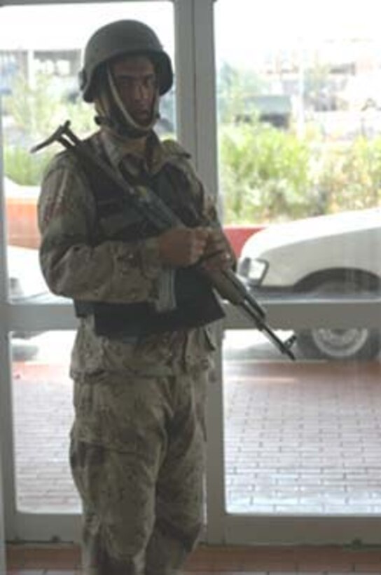 AR, RAMADI, Iraq (March 8, 2005) - An Iraqi Security Force commando guards an entrance of the Ar Ramadi General Hospital here. More than 20 ISF Commandos operated alongside Marines with Company A, 1st Battalion, 5th Marines joined Company G, 2nd Battalion, 5th Marines in a raid on the hospital in search of weapons caches, insurgents and crimes against humanity. First Battalion, 5th Marines' Human Exploitation Team, Information Operations, the 4th and 5th Civil Affairs Groups and more than 20 Iraqi Security Force Commandos also participated in the mission, which lasted more than four hours. (Official United States Marine Corps photo by Cpl. Tom Sloan)