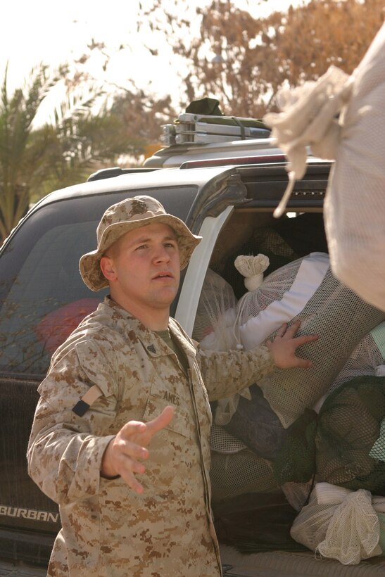 Corporal Steven Bruce Ames II, a 22-year-old Willard Ohio native and personnel administration non-commissioned officer, delivers laundry to the staff billeting here, March 8.  Ames recently arrived here to serve his country in the Global War on Terrorism.  U.S. Marine Corps photo by Sgt. Stephen D'Alessio (RELEASED)