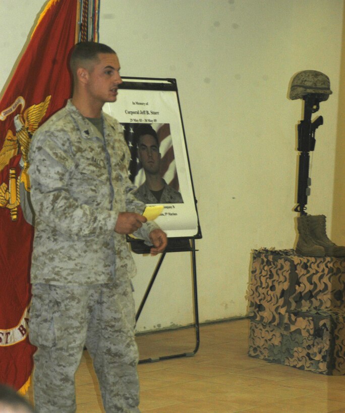 CAMP RAMADI Ar Ramadi, Iraq (June 7, 2005) - Corporal Donald W. Ball, a team leader and rifleman with 3rd Squad, Weapons Platoon, Company B, 1st Battalion, 5th Marine Regiment, delivers a eulogy during a memorial ceremony here for Cpl. Jeff B. Starr. Starr was killed May 30, Memorial Day, by small arms fire while conducting operations against enemy forces in this city. Starr was a 22-year-old native of Snohomish, Wash. Ball, a 22-year-old from Salt Lake City, served alongside Starr during three deployments in support of Operation Iraqi Freedom. Photo by: Cpl. Tom Sloan