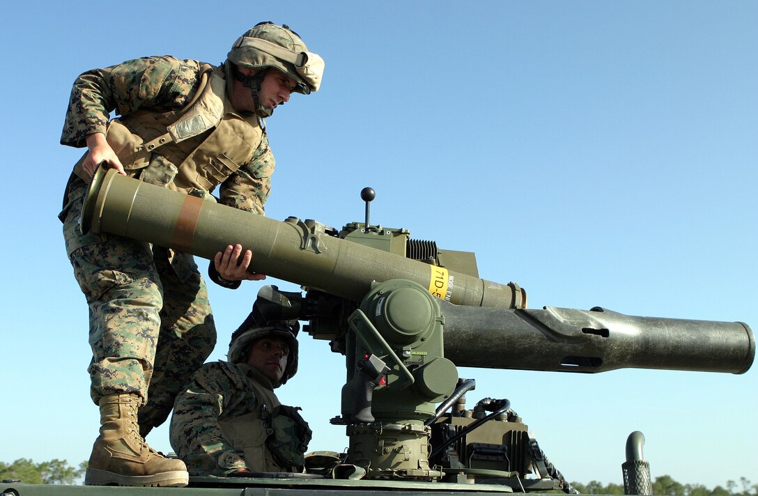 CAMP LEJEUNE, N.C. -- Twenty-two-year-old Knoxville, Tenn., native Cpl. Chad R. Slagle, Weapons Co., 2nd Battalion, 2nd Marine Regiment, 2nd Marine Division loads a missile into a tube-launched, wire command-link guided missile system, known as the TOW, during a field test of the Improved Target Aquisition System June 8, 2005.  The ITAS gives TOW gunners the ability to see twice as far as the original optics and combines day and night sights into one.  (Official U.S. Marine Corps photo by Sgt. Jerad W. Alexander)