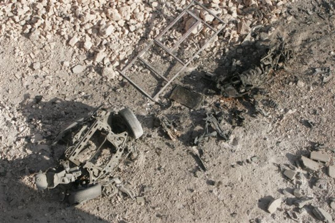 KARABILAH, Iraq ? View from the roof top of a two story house of the wreckage of a vehicle-borne improvised explosive device used against 3rd Platoon, Nov 8. The Marines assigned to 3rd Platoon, Company E, 2nd Battalion, 1st Marine Regiment, participated in Operation Steel Curtain against insurgents within border towns on the Lower Euphrates River Valley recently.