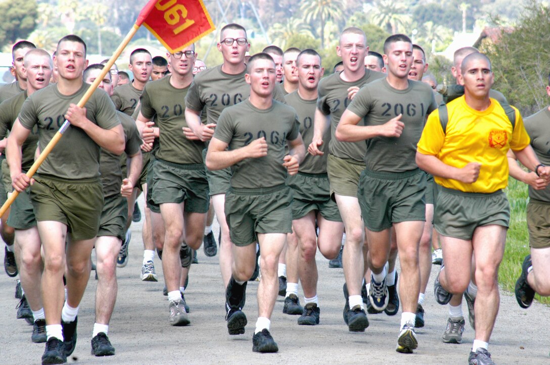 Sgt. Nolan P. Espinoza, drill instructor, Platoon 2058, Company F, leads platoon 2061 in a 2 mile run before going on to the strength and endurance course. Leading the platoon is Pfc. Anton Chumak, Pfc. Nathan Chambers and Pfc. Aaron Kammann.
