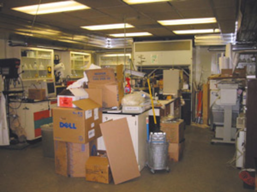 A former Maintenance Center chemical analysis laboratory was not being used, and was a classic example of a waste of space. The Lean Team cleared the room and retrofitted it to become a room with offices and a conference room.