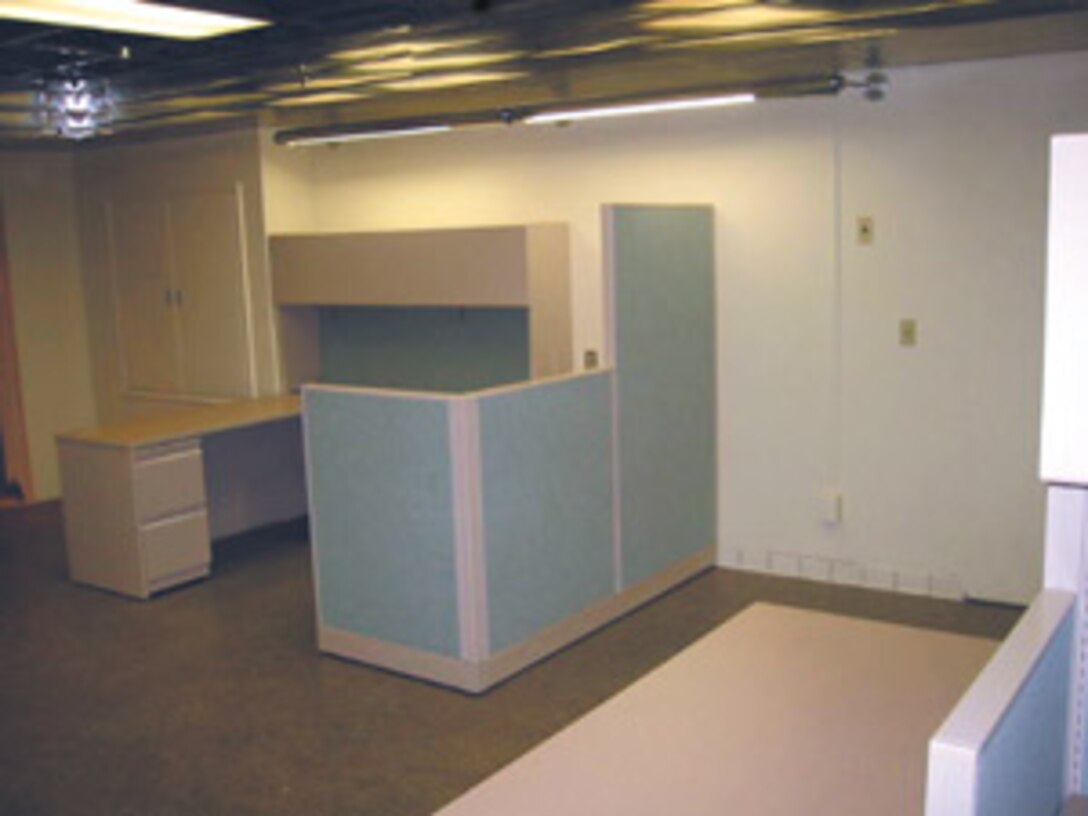 A former Maintenance Center chemical analysis laboratory was not being used, and was a classic example of a waste of space. The Lean Team cleared the room and retrofitted it to become a room with offices and a conference room.