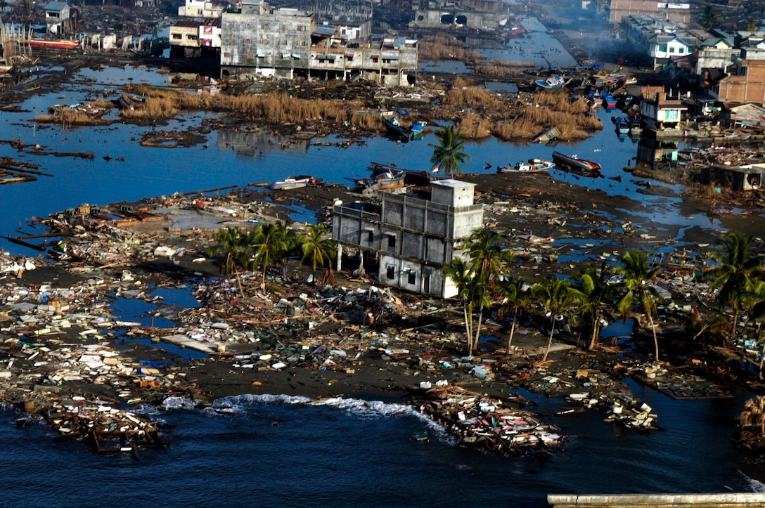BLANG PIDIE, Indonesia (Jan. 9, 2005) -- A lone structure stands in a sea of debris on a small land mass totally destroyed by the Dec. 26 tsunami. The 15th Marine Expeditionary Unit (Special Operations Capable) has been providing desperately needed humanitarian aid to cities and villages along more than 150 miles of Sumatra's western coastline.  (Photo by Gunnery Sgt. Robert Knoll)