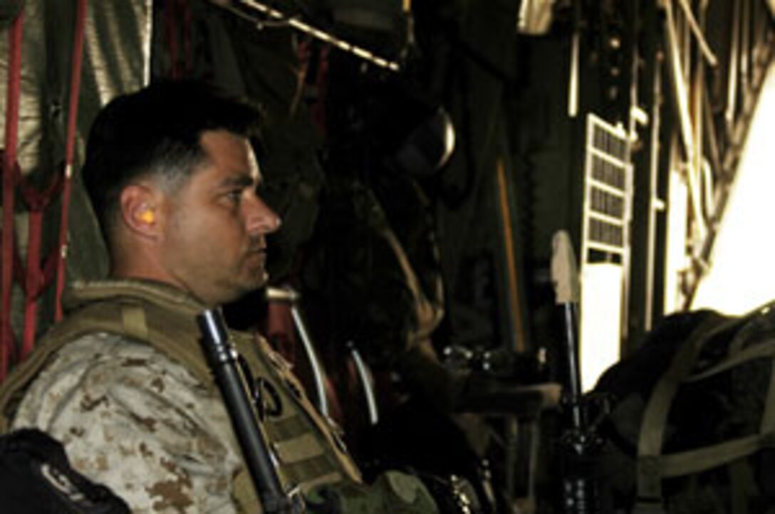 Chief Petty Officer William Minor, 37, medical detachment chief for MEU Service Support Group 15 and native of Norwalk, Ohio, waits patiently to exit an Air Force C-130 Hurcles at Baghdad International Airport. MSSG-15, the Combat Service Support Element of 15th Marine Expeditionary Unit (Special Operations Capable) is currently conducting security and stabilization operations in Iraq.