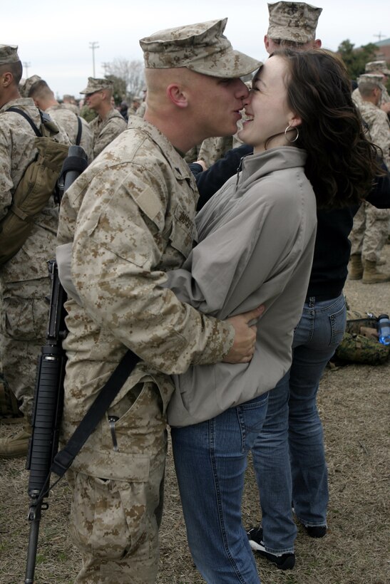 MARINE CORPS BASE CAMP LEJEUNE, N.C. - A Marine with 1st Battalion, 6th Marine Regiment kisses his loved one goodbye before boarding a bus headed for Marine Corps Air Station Cherry Point, N.C.   The unit will fly out from there with a final destination of Fallujah, Iraq, where they will conduct security and stability operations and help rebuild the city's infrastructure.