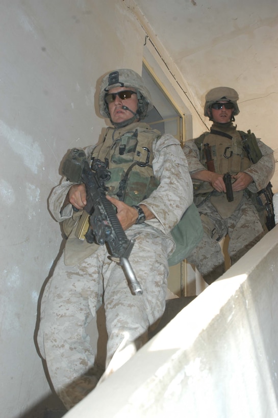AR RAMADI, Iraq (June 2, 2005) - Lance Cpl. Tony Leal, a rifleman and team leader with 3rd Squad, 4th Platoon, Company A, 1st Battalion, 5th Marine Regiment, walks down stairs in a house he and his Marines searched during a mission in the city here.  The 24-year-old from Staford, Texas, is on his second deployment to Iraq supporting Operation Iraqi Freedom. Leal is a 2003 graduate of Sam Houston State University, Huntsville, Texas, and holds an Associates degree in criminal justice. Photo by: Cpl. Tom Sloan