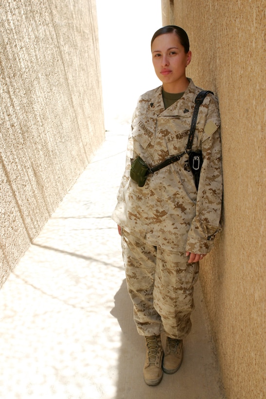 CAMP BLUE DIAMOND, AR RAMADI, Iraq -- Corporal Teresa T. Fernandez received a combat meritorious promotion this month for her work as a 2nd Marine Division Headquarters Battalion armorer.  She is one of only a few Marines responsible for the maintenance and repair of several units' weapons.  U.S. Marine Corps photo by Sgt. Stephen D'Alessio (RELEASED)