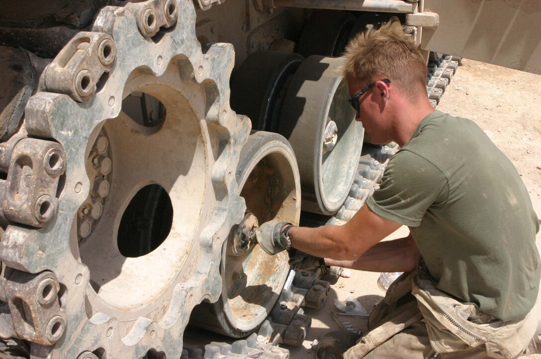 LCpl. Jonathan M. Griffith, M1A1 main battle tank repair technician/M1A1 tank crewman, Headquarters Platoon, Company A, 1st Tank Battalion, 7th Marine Regiment, Regimental Combat Team-2, works two jobs to ensure that the Marines' tanks stay operational. (Photo by LCpl. Zachary W. Lester)