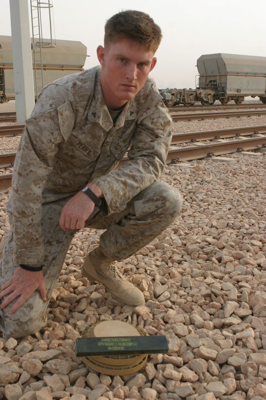 CAMP AL QA'IM, Iraq (June 5, 2005)- Lance Cpl. Joshua D. Perry, a combat engineer with Company A, 4th Combat Engineer Battalion currently supporting 3rd Battalion, 2nd Marine Regiment, Regimental Combat Team-2 joined the Marine Corps in 2003 to help with college and earn the title of Marine. Two years later he is responsible for finding and detonating mines and breaching doors during raids to find insurgents. Official U.S. Marine Corps photo by Lance Cpl. Lucian Friel (RELEASED)