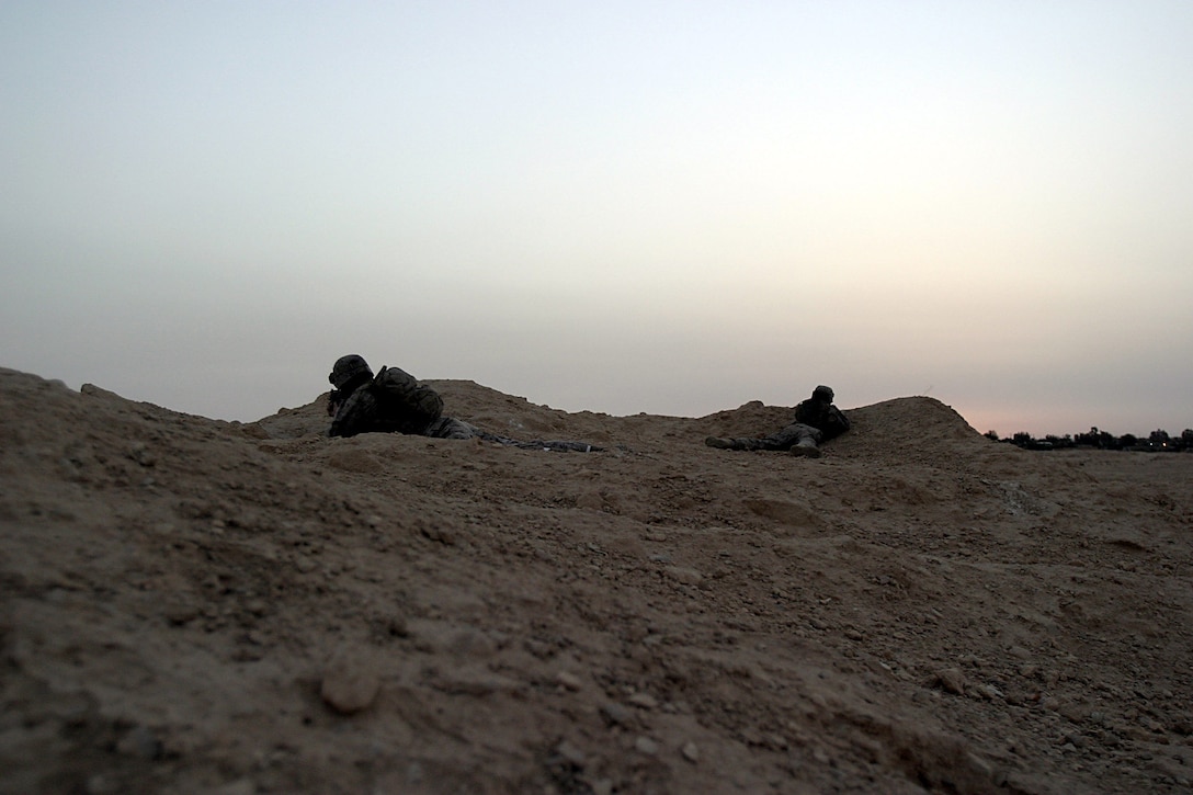 Dam Village, Al Anbar, Iraq  - Two Marines with 2nd platoon, Lima Company, 3/25  provide security at an observation post.