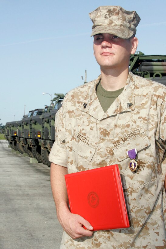 MARINE CORPS BASE CAMP LEJEUNE, N.C. - Corporal James A. Bedell, a scout observer with Echo Battery, 2nd Battalion, 10th Marine Regiment, received the Purple Heart for wounds received in action during a recent deployment to Iraq.  He was presented the award here June 9.