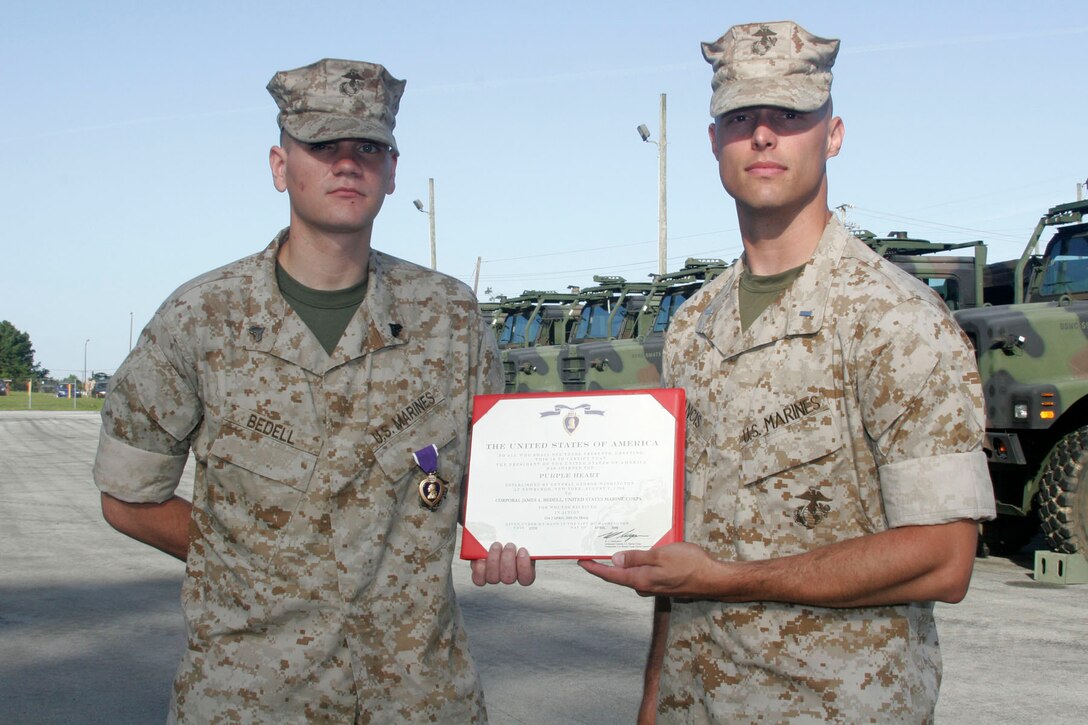 MARINE CORPS BASE CAMP LEJEUNE, N.C. - Corporal James A. Bedell, a scout observer with Echo Battery, 2nd Battalion, 10th Marine Regiment, received the Purple Heart for wounds received in action during a recent deployment to Iraq.  He was presented the award here June 9.