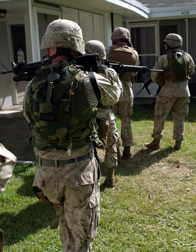 TARAWA TERRACE I, N.C. - Marines from C. Company, 2d Combat Engineer Battalion, 2d Marine Division advance on a building during urban warfare training June 9, 2005.