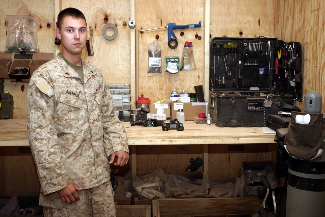 CAMP BAHARIA, Iraq - Lance Cpl. Raphael Brenner works as an electro-optical ordnance technician with 1st Battalion, 6th Marine Regiment.  Every week, the 22-year-old Caledonia, Mich. native and other armory staff troubleshoot, inspect and repair more than 100 rifles, machineguns and night-vision units that infantrymen use while they patrol the streets of Fallujah.