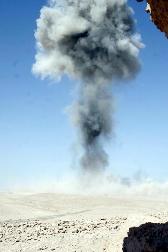 Barwana, Iraq (October 9, 2005)-- The scene after more than 900 pounds of enemy weaponry was destroyed after finding a hidden underground bunker in the desert here.  (Official USMC Photo by Corporal Ken Melton)