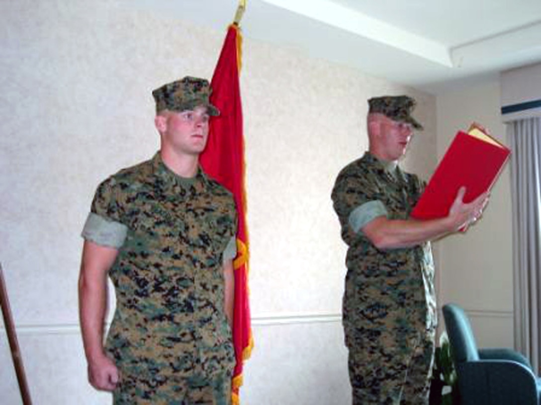 Second Lieutenant Phillip J. Peacock accepts his commission as Capt. David L. Jones, RS Denver officer selection officer, reads his citation.