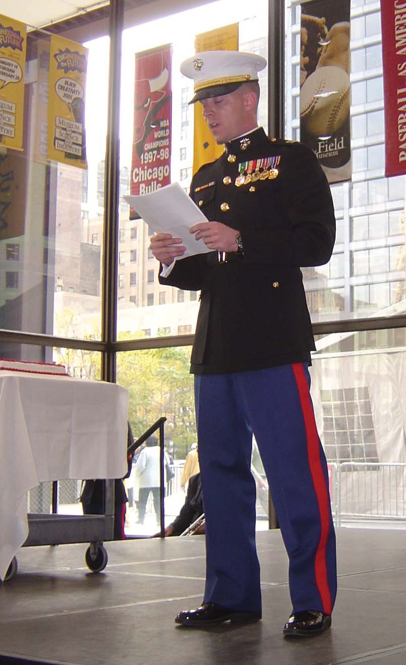 Captain Michael Kaniuk reads Gen. John A. LeJeune's birthday message at a cake-cutting ceremony during the official Chicagoland commemoration ceremony.