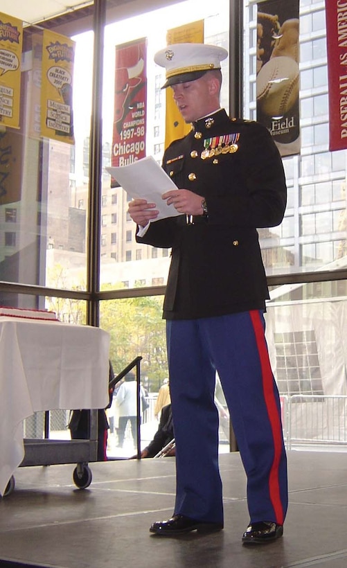 Captain Michael Kaniuk reads Gen. John A. LeJeune's birthday message at a cake-cutting ceremony during the official Chicagoland commemoration ceremony.
