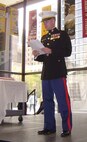 Captain Michael Kaniuk reads Gen. John A. LeJeune's birthday message at a cake-cutting ceremony during the official Chicagoland commemoration ceremony.