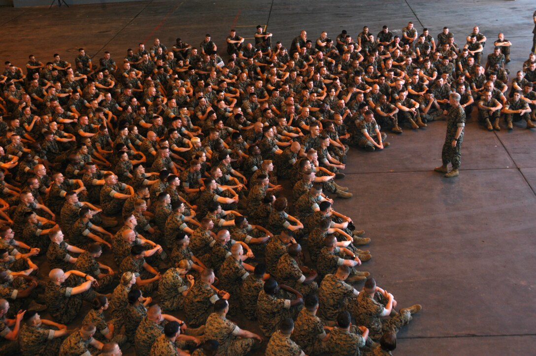 Navy Capt. Stephen Epperson, the 2nd Marine Aircraft Wing command chaplain, prays with Marines and Sailors during the Marine Corps birthday celebration at Al Asad, Iraq, Nov., 10.