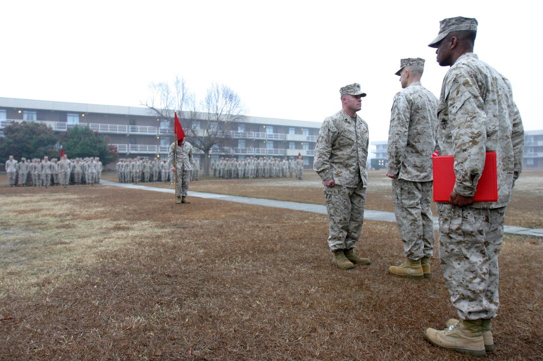 Staff Sgt. Nathan Hunt, a North Benton, Ohio native and platoon sergeant with 2d Battalion, 2d Marine Regiment, stands in front of his commanders at Camp Lejeune before receiving a Bronze Star with a combat distinguishing device recently for his heroics actions while serving in Iraq. Hunt was one of 15 Marines and one sailor in his battalion who received awards that day for their combat actions in Iraq.