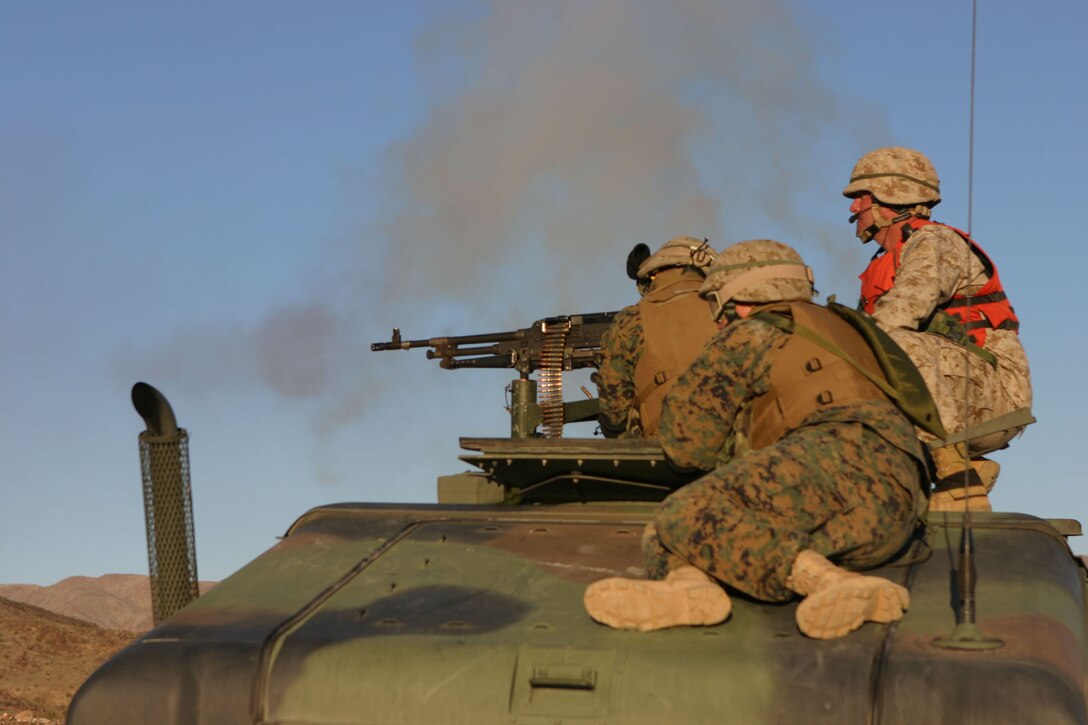 050111-M-4224F-003 29 PALMS, Calif.- Marines with the Security Platoon with 3rd Battalion, 2d Marine Regiment fire at the enemy to help their fellow Marines on the ground during the Hasty Squad Attack and Live Grenade Range. This training was the last opportunity for the Marines of 3/2 to prepare for deployment to Iraq. U.S. Marine Corps photo by Lance Cpl. Lucian Friel (RELEASED)