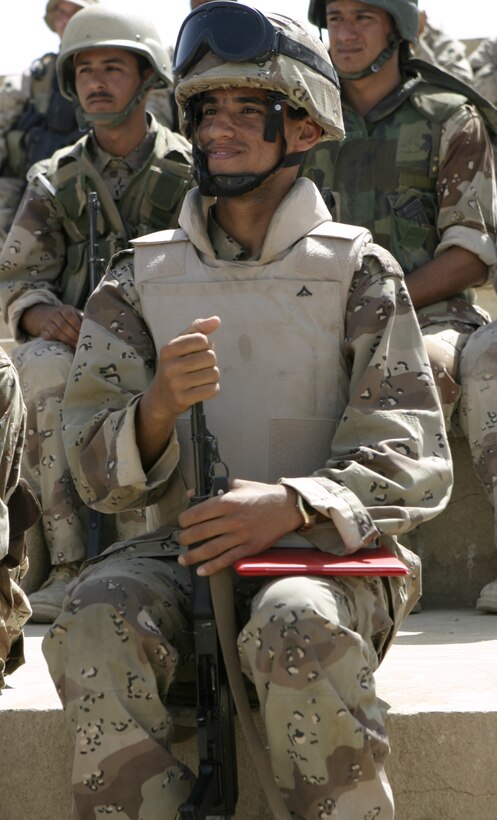 FALLUJAH, Iraq - A soldier with the Iraqi Security Forces' 2nd Brigade proudly smiles as he holds his class graduation certificate here.  The soldiers graduated April 30 from a five-day long squad tactics training course, during which 1st Battalion, 6th Marine Regiment personnel taught them skills such as patrolling, first aid in combat and urban war fighting tactics.
