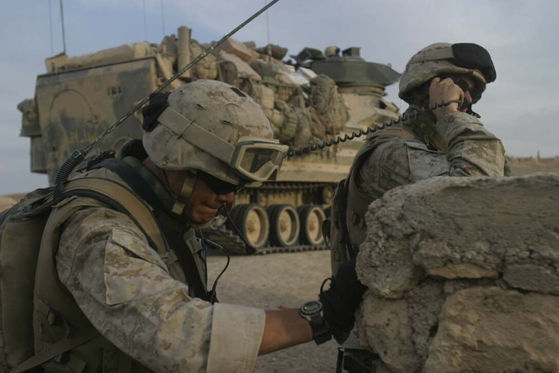 AL UBAYDI, Iraq- LCpl Williams, a radio operator with 3d Battalion, 25th Marines Lima Co. carries the radio used by Captian Toland, the commmandig officer of 3d Platoon, Lima Co. May 10, 2005 during Operation Matador.Operation Matador is for disrupting the insurgents known to be a staging area for Syrian and other nationality foreign insurgents. 2D Marine Division is conducting security and stabilization operations in support of Operation Iraqi Freedom III. (OFFICIAL USMC PHOTO BY CPL ERIC C ELY, 2D MARINE DIVISION COMBAT CAMERA)-UNRELEASED