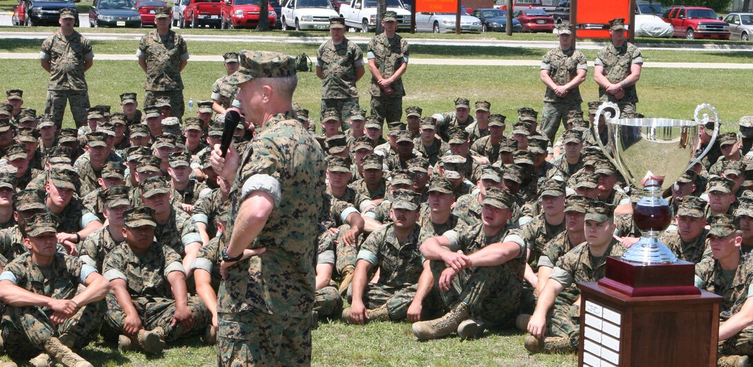 Lt. Gen. James F. Amos, commanding general, II MEF, addresses the Marines of 2nd Combat Engineer Bn., 2nd Marine Division, here May 10 in front of the Lt. Gen. Chesty Puller Award trophy.  The battalion was named winner of the award, which is given for outstanding unit leadership, in the medium-sized category for commands with 201 to 800 sailors and Marines.