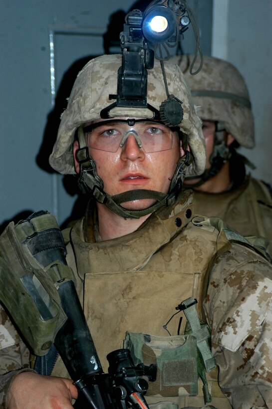 AR RAMADI Iraq (July 10, 2005) - Corporal Paul M. Titus, a mortar man with 4th Platoon, Company W, 1st Battalion, 5th Marine Regiment, was part of a mission in the city here early July 10, which resulted in the capture of an insurgent. The 22-year-old from Yonkers, N.Y., and fellow Marines with 3rd and 4th Platoon conducted a raid between 1 a.m. and 3 a.m., during which time they captured an insurgent responsible for launching small arms and improvised explosive device(IED) attacks on coalition forces. Photo by: Cpl. Tom Sloan