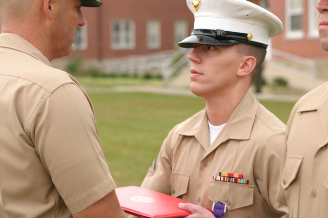 MARINE CORPS BASE CAMP LEJEUNE, N.C. (Nov. 10, 2005)- Lance Cpl. John Myslinski, 27, a Marine from Freehold, N.J., with Headquarters Battalion, 2nd Marine Division receives a Purple Heart for wounds received in action in Ramadi, Iraq in June while supporting Operation Iraqi Freedom.
