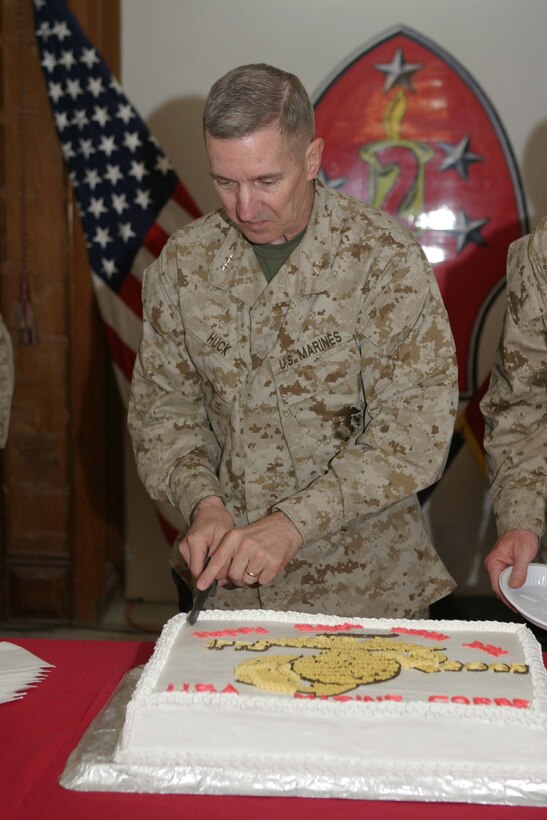 CAMP BLUE DIAMOND, RAMADI, Iraq -  Major General Richard Huck, commanding general 2d Marine Division, cuts the first piece of cake here during a celebration of the Marine Corps 230th Anniversary. Official U.S. Marine Corps photo by Sgt. Ryan S. Scranton