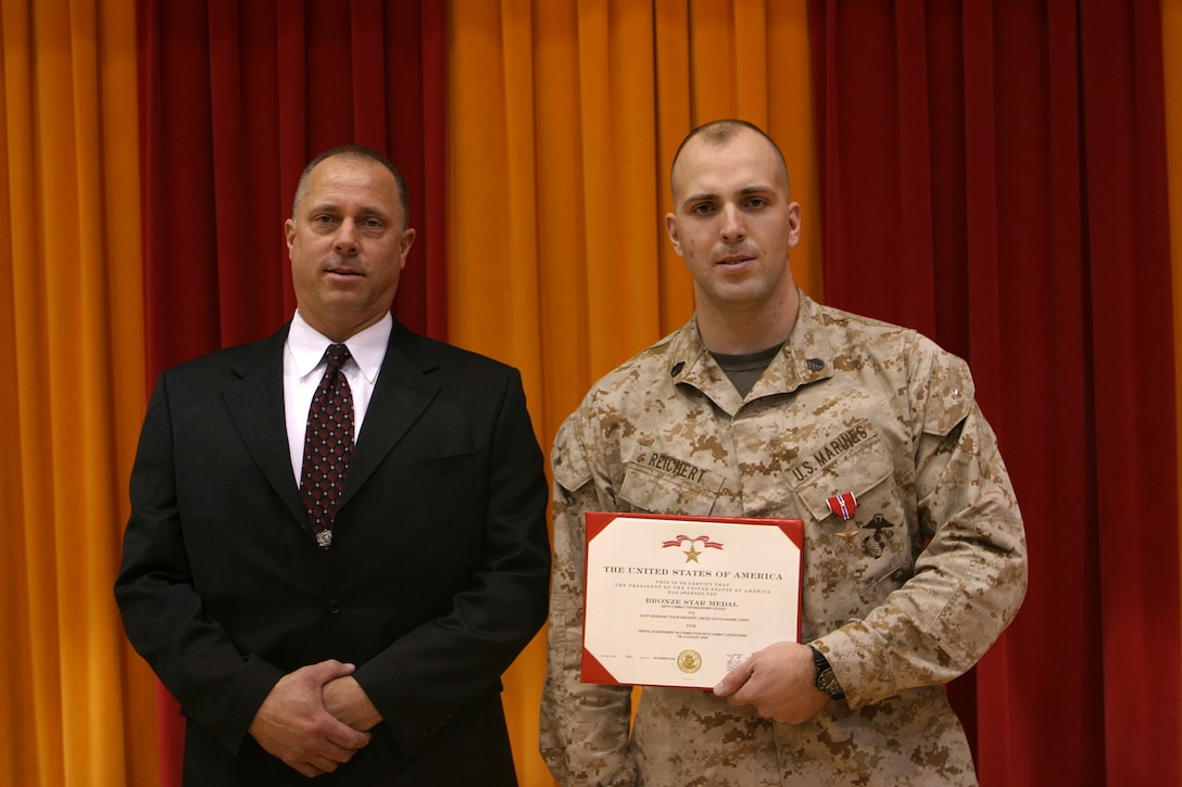 MARINE CORPS BASE CAMP LEJEUNE, N.C. (February 10, 2005) Marines from different sections of 2d Battalion, 2d Marine Regiment received awards here Feb. 10 for actions performed during Operation Iraqi Freedom 2002 through 2004. Awards for five Marines and two sailors included six Navy and Marine Corps Commendation Medal and a Bronze Star.  Most of the awards were received with a combat distinguishing device to signify the awards were given for actions while in combat. Staff Sgt. Steve C. Reichert was presented the Bronze Star with a combat distinguishing device for action taken in combat by Brig. Gen. Joseph J. McMenamin.